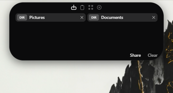 ชั้นวางไฟล์ที่มีโฟลเดอร์ Pictures และ Documents พร้อมปุ่ม Share และ Clear